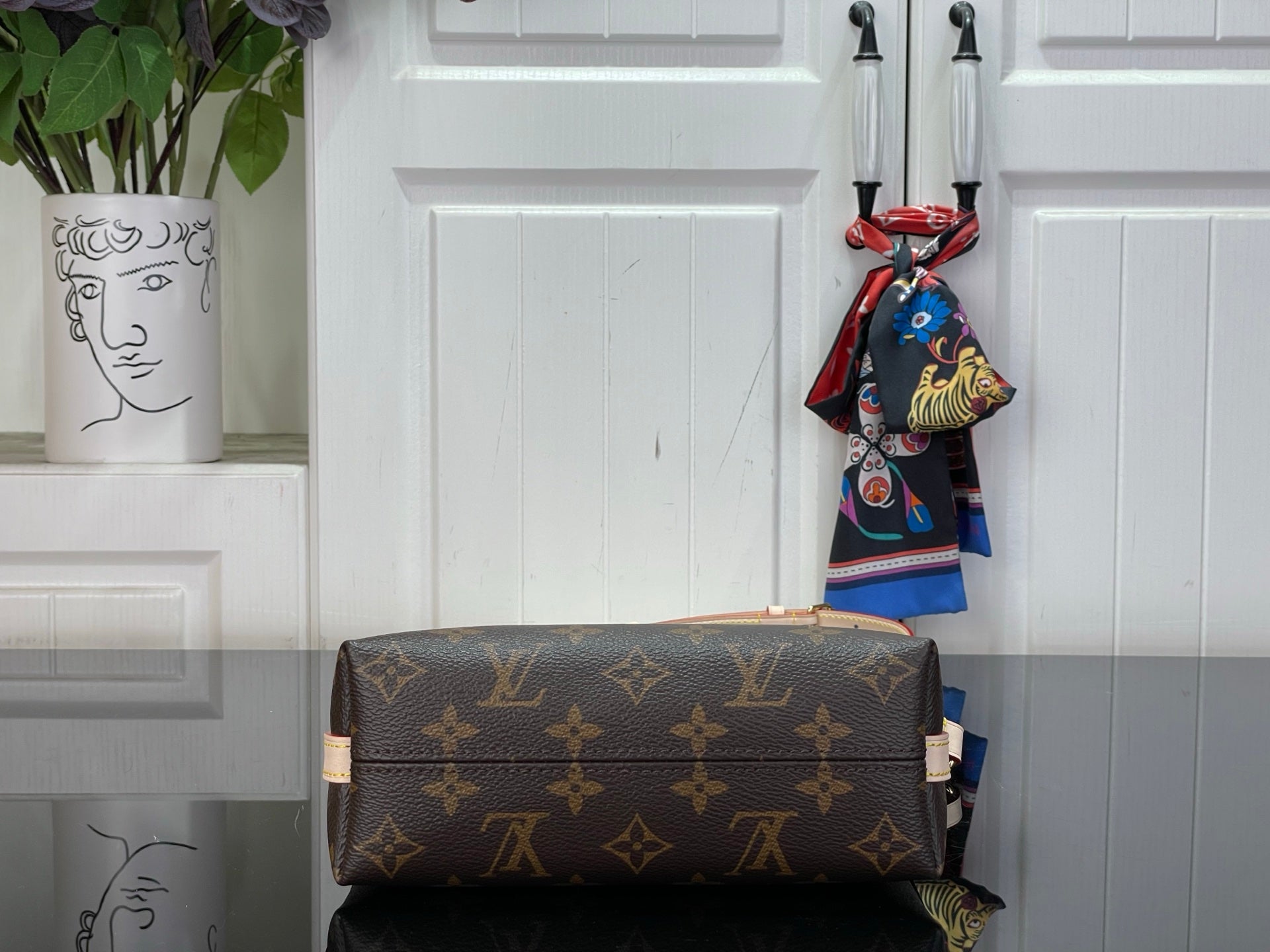 Louis Vuitton monogram top-handle bag in dark brown with gold zipper trim