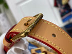 Louis Vuitton bag zipper pull with engraved Louis Vuitton, tan leather strap and red trim