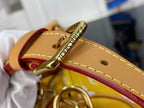Louis Vuitton bag clasp and tan strap with stitched edge and metal hardware.