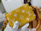 Louis Vuitton mini bag in yellow with white monogram print and tan shoulder strap.