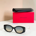 Black round eyeglasses with clear lenses and glossy frame