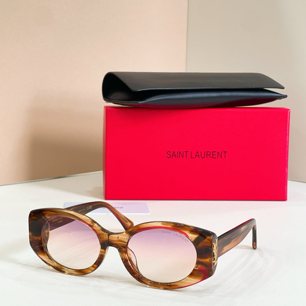 Tortoiseshell round sunglasses with warm lenses and gold temple detail