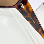 Gucci sunglasses temple with Gucci logo and Made in Italy marking.
