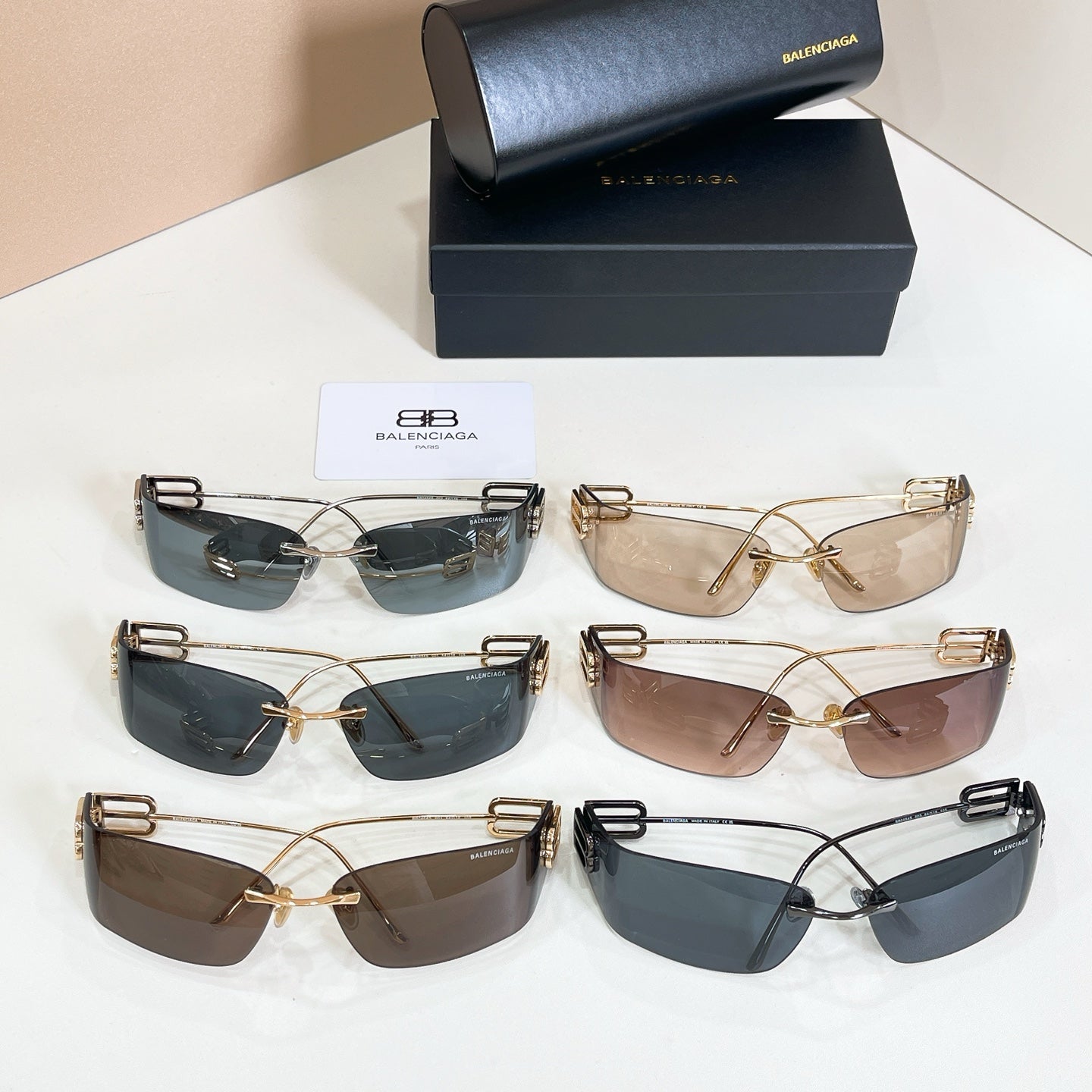 Assorted Balenciaga sunglasses set: gold frames with tinted lenses in dark, gray, and brown
