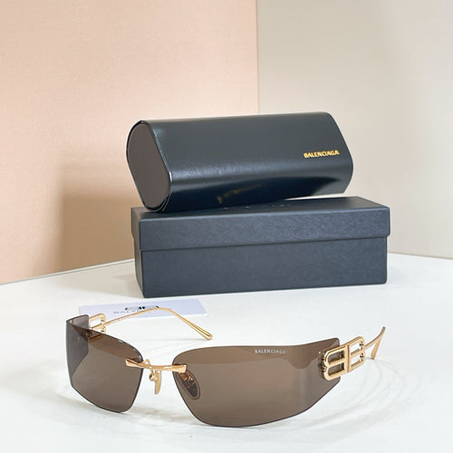 Gold-frame sunglasses with dark gradient lenses and Balenciaga B logo temple detail