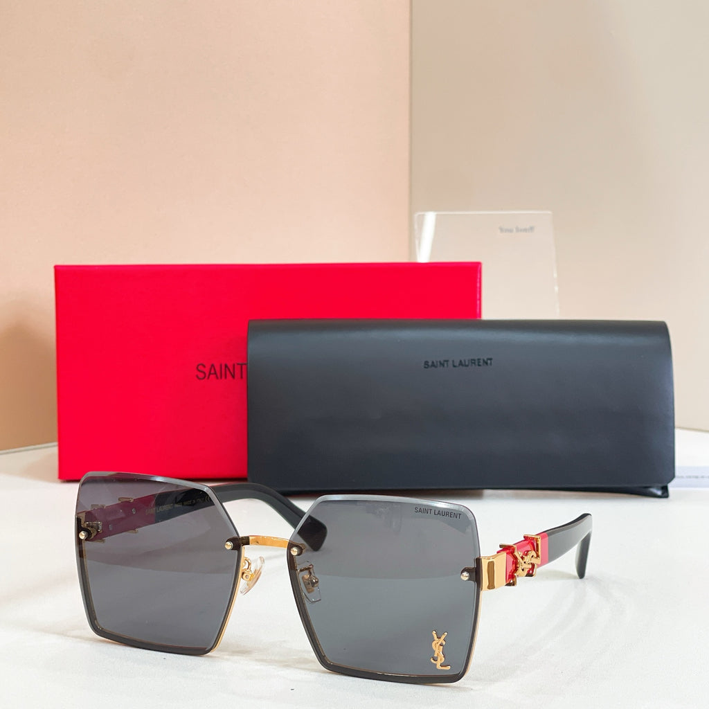 YSL glasses, gray-tinted lenses with dark frames and gold side logo detail