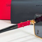 Glasses arm detail with red acetate and gold logo hardware