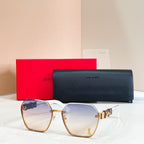 Oversized sunglasses, light purple gradient lenses, gold-tone frame with logo temple detail
