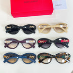 YSL glasses set: four pairs in blue, black, maroon, and tortoise