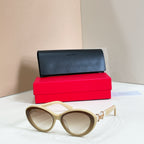 YSL glasses, beige cat-eye frames with tinted lenses