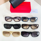 Assorted rectangular eyeglasses with tinted lenses in black, blue, tan, and tortoiseshell
