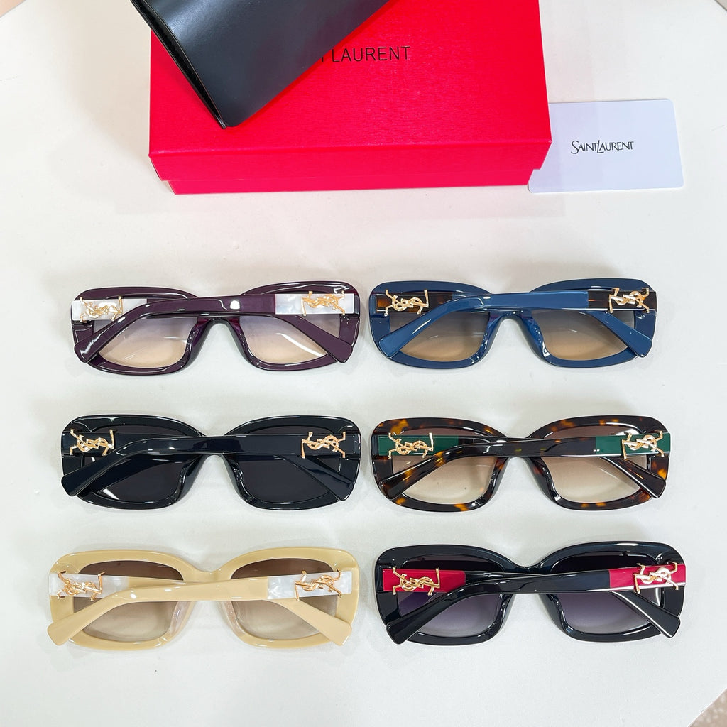Assorted rectangular eyeglasses with clear or tinted lenses in multiple colors and gold accents