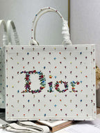 White Dior tote bag front with multicolor embroidered floral letter design