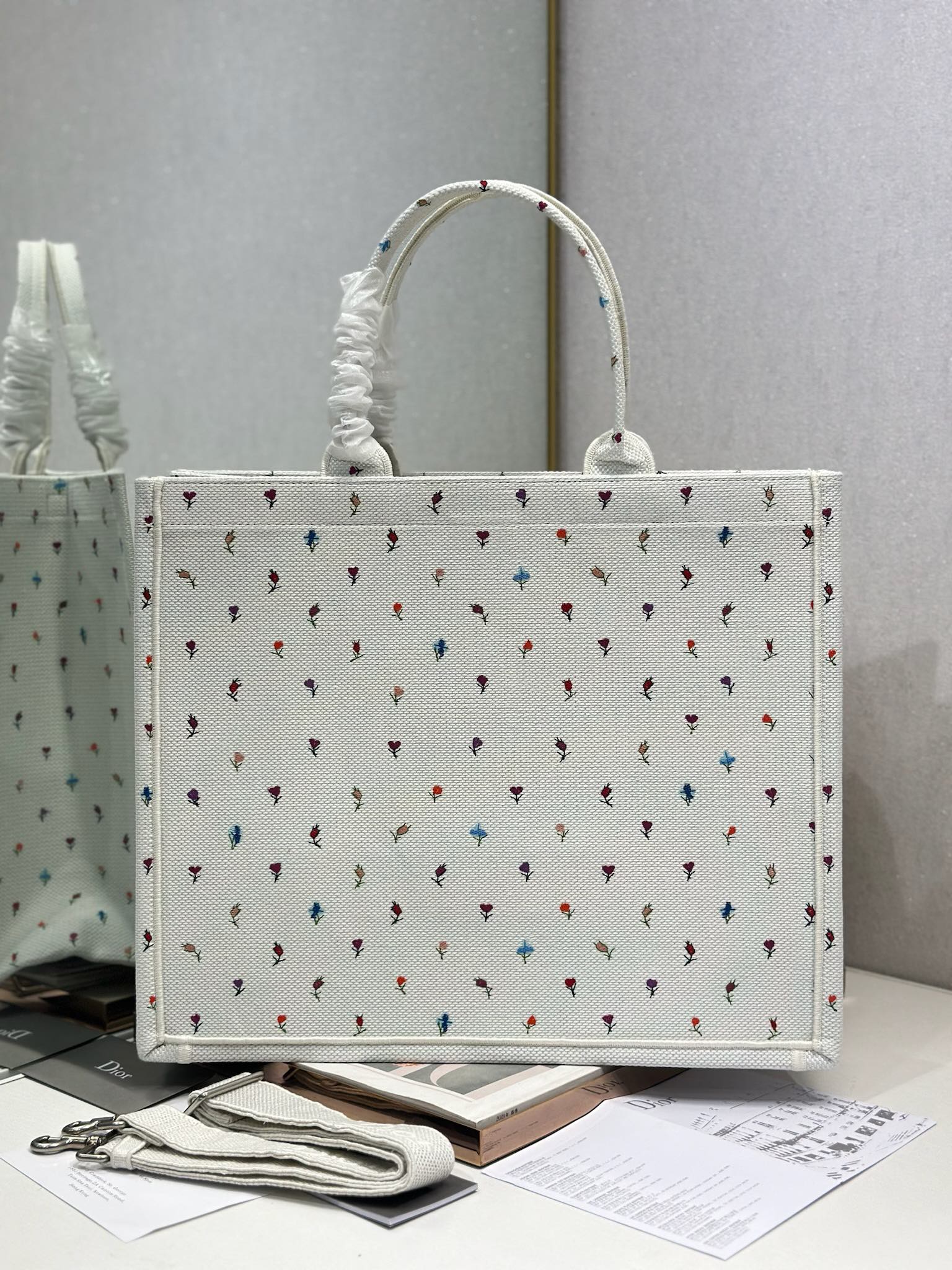 White Dior tote bag with ruched handle and allover multicolor motif