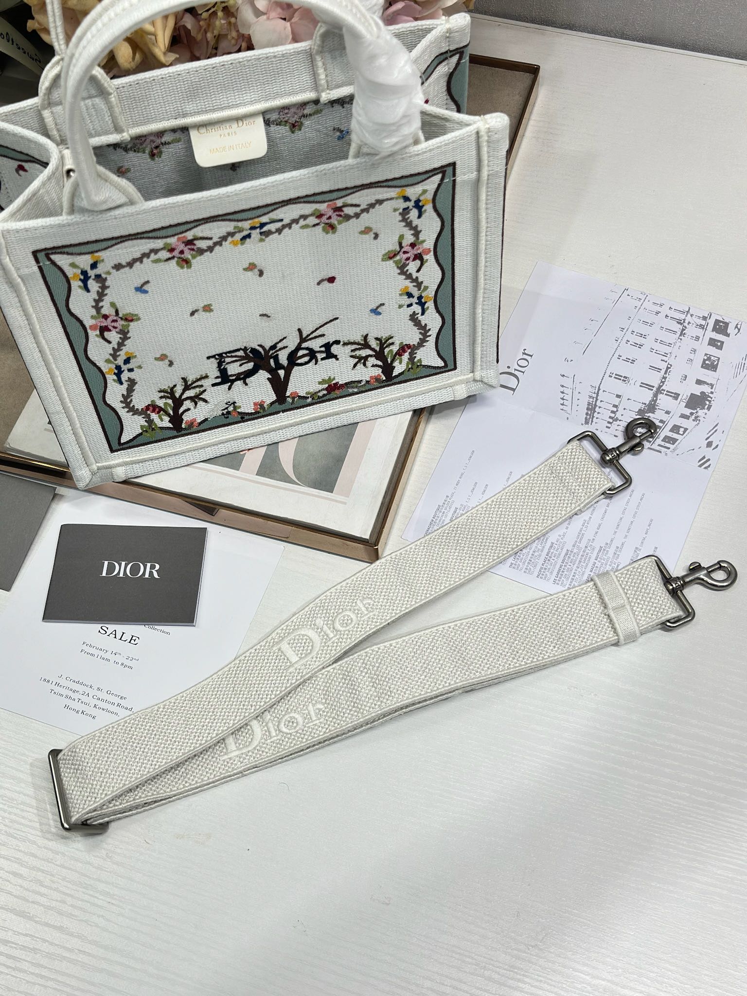 Dior tote bag with long light gray strap and embroidered front panel