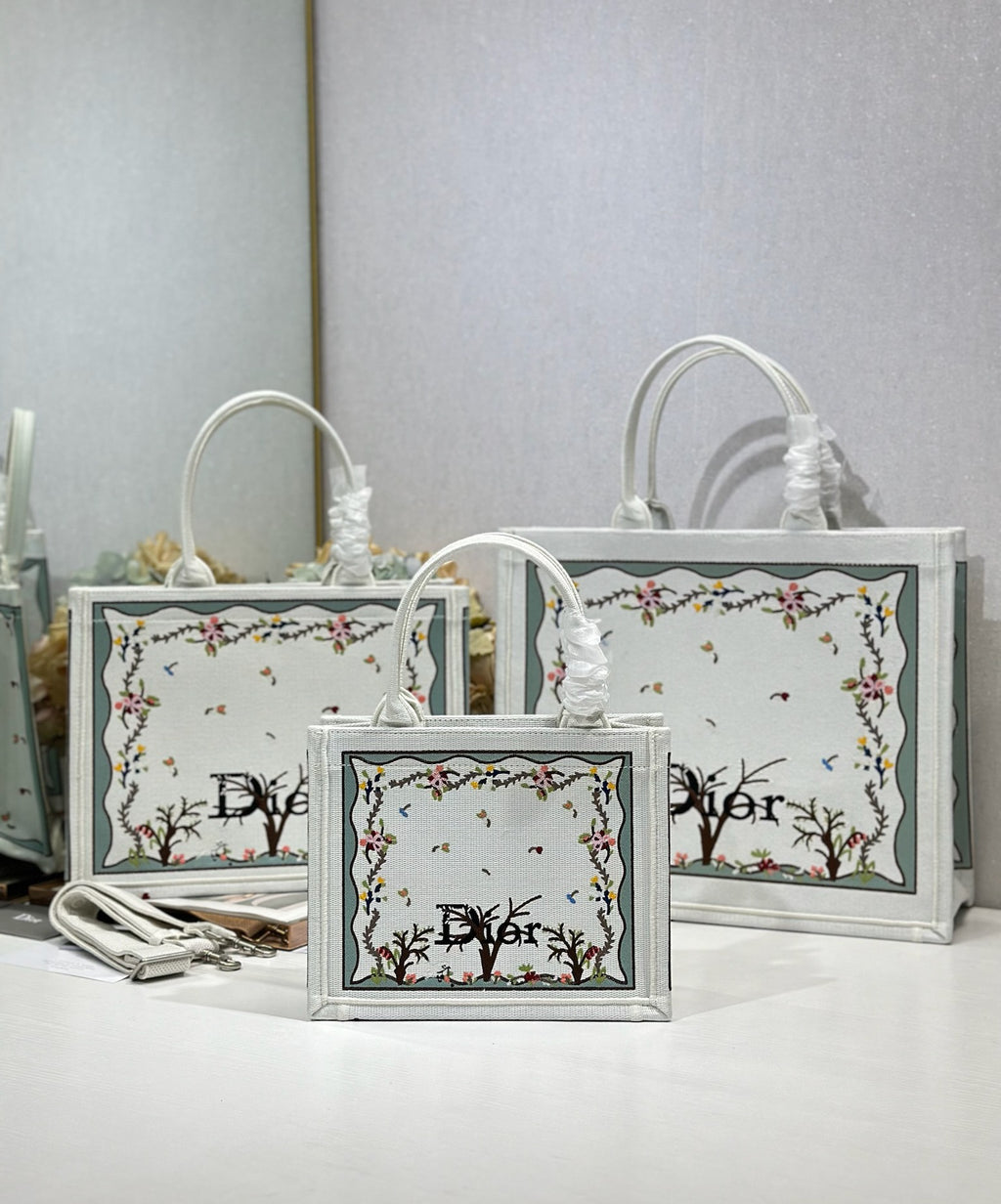 White Dior tote bags with floral tree border print and oval logo medallions