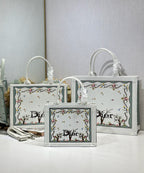 White Dior tote bags with floral tree border print and oval logo medallions