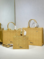 Gold Dior tote bags with textured pattern, oval logos, and matching small pouch