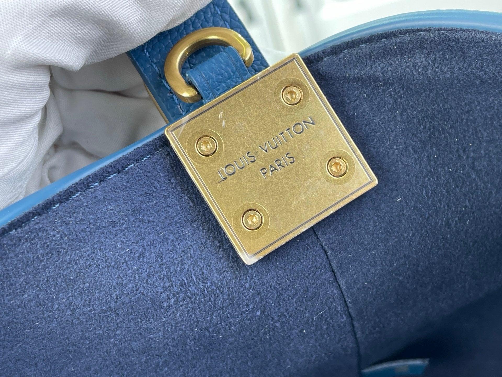 Blue leather bag with gold square lock plate, Louis Vuitton Paris stamp