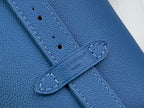 Blue leather strap with stitched edges and metal ring keeper