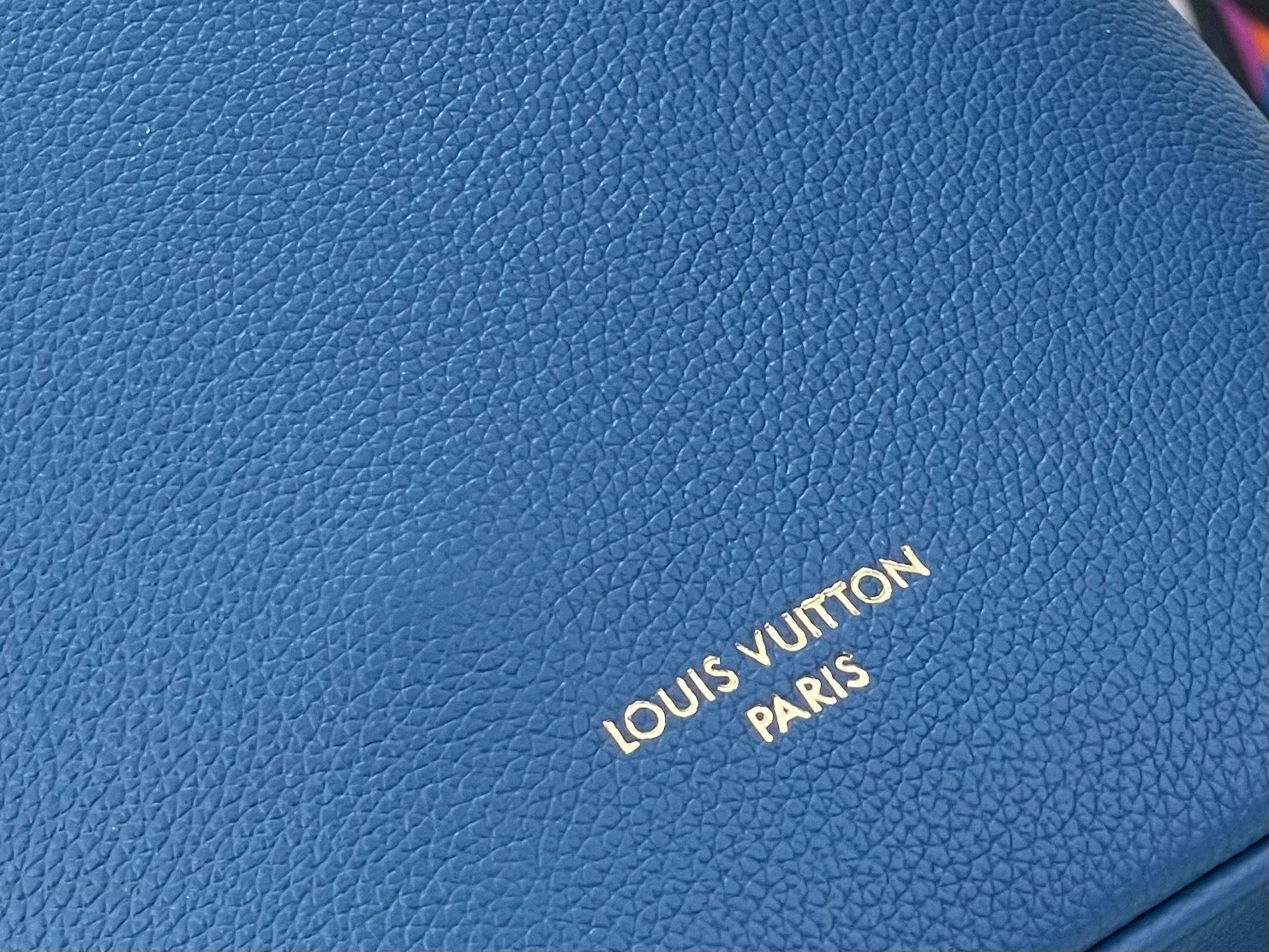 Blue pebbled leather bag panel with Louis Vuitton Paris logo