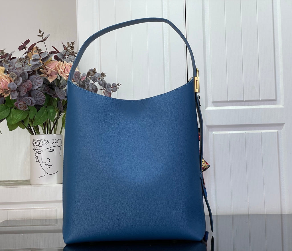Louis Vuitton blue tote bag with top handle and gold side hardware