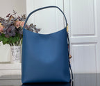 Louis Vuitton blue tote bag with top handle and gold side hardware