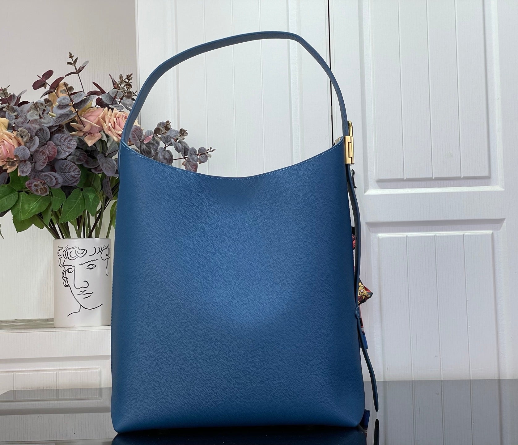 Louis Vuitton blue tote bag with top handle and gold side hardware