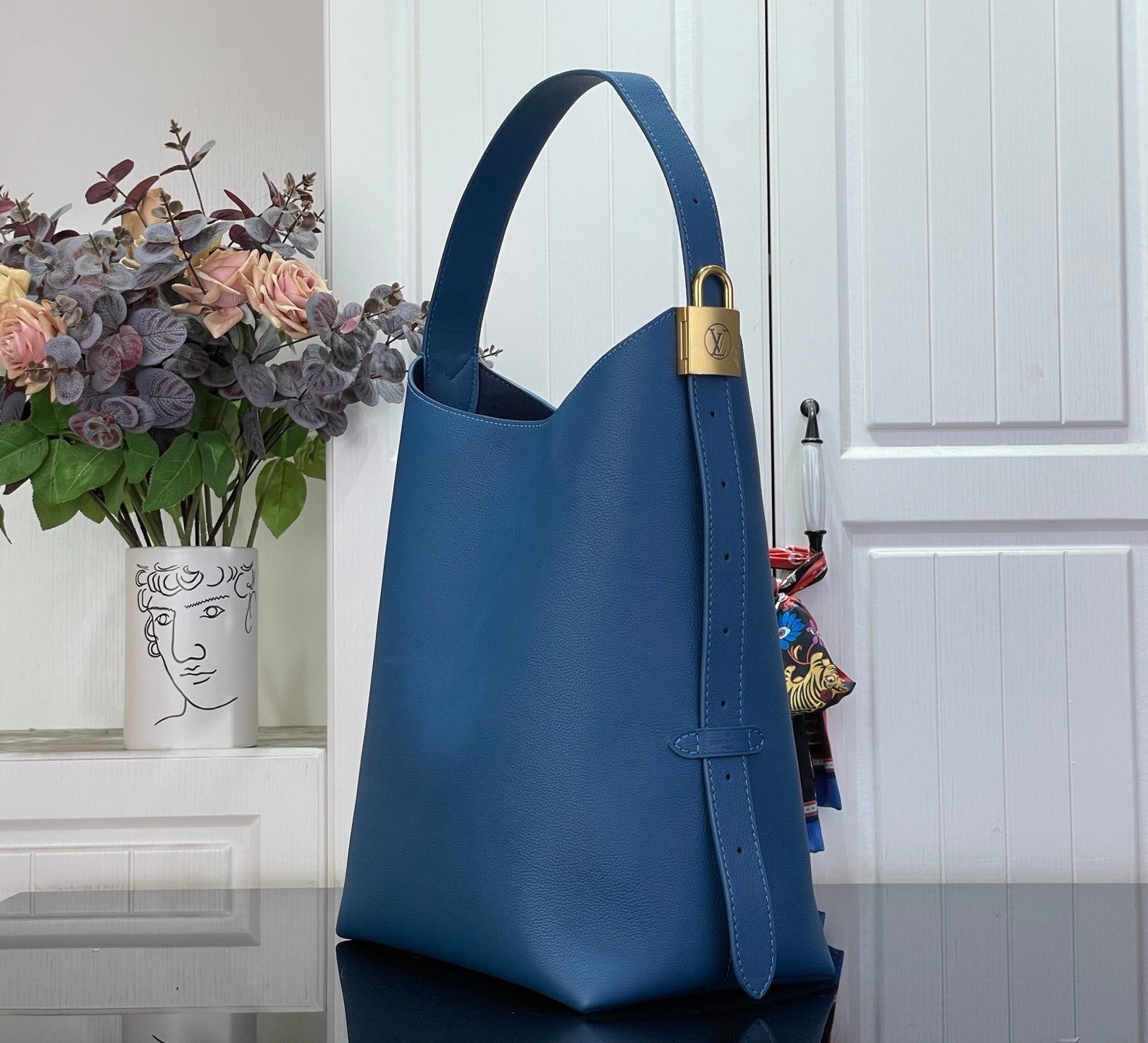 Louis Vuitton blue tote bag with top handle and adjustable shoulder strap