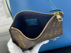Louis Vuitton monogram wristlet pouch interior with blue leather lining and zipper