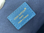 Louis Vuitton blue leather tag with “LOUIS VUITTON PARIS” and “made in France”