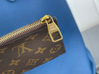 Louis Vuitton monogram pouch with gold zipper pull, brown exterior
