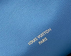 Louis Vuitton blue pebbled leather with debossed “LOUIS VUITTON PARIS” text