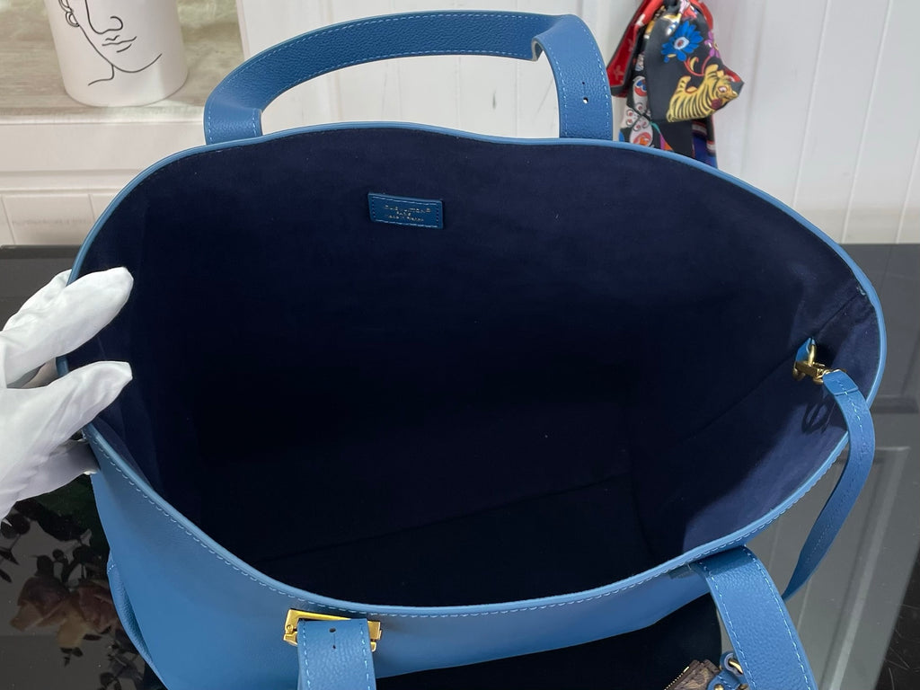 Louis Vuitton blue tote bag interior with open top and fabric lining