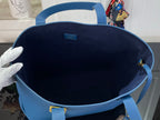 Louis Vuitton blue tote bag interior with open top and fabric lining