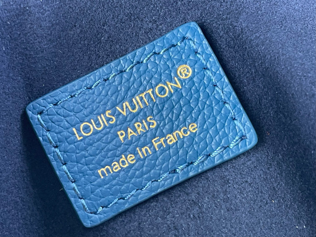 Louis Vuitton label on blue pebbled leather, 'made in France'