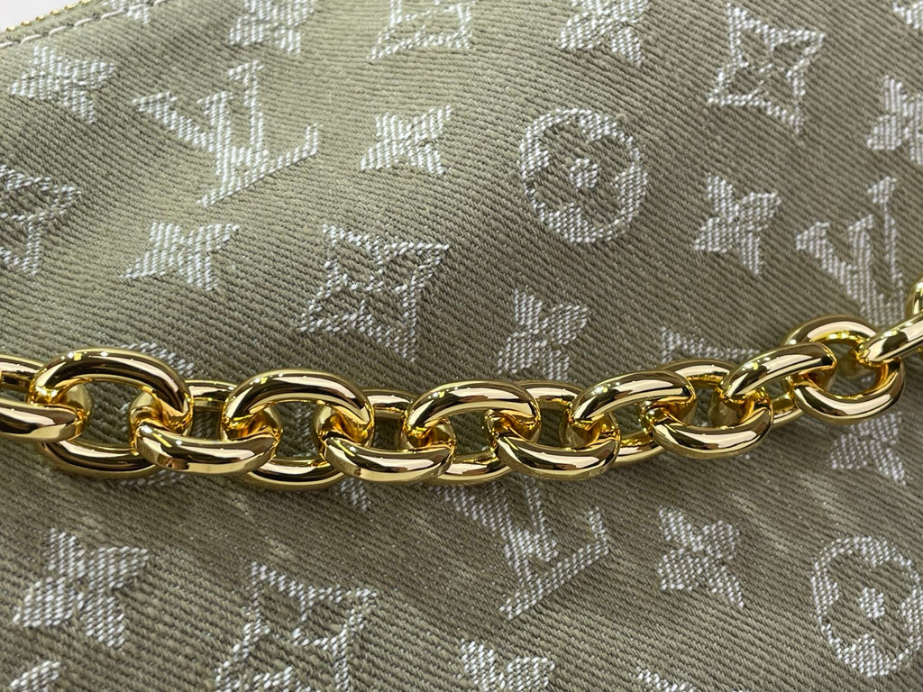 Gold-tone chain on Louis Vuitton monogram canvas handbag