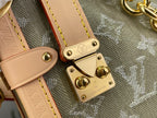 Louis Vuitton monogram handbag metal clasp with leather tabs and snap closure
