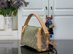 Louis Vuitton monogram handbag with structured top handles and gold-tone chain strap