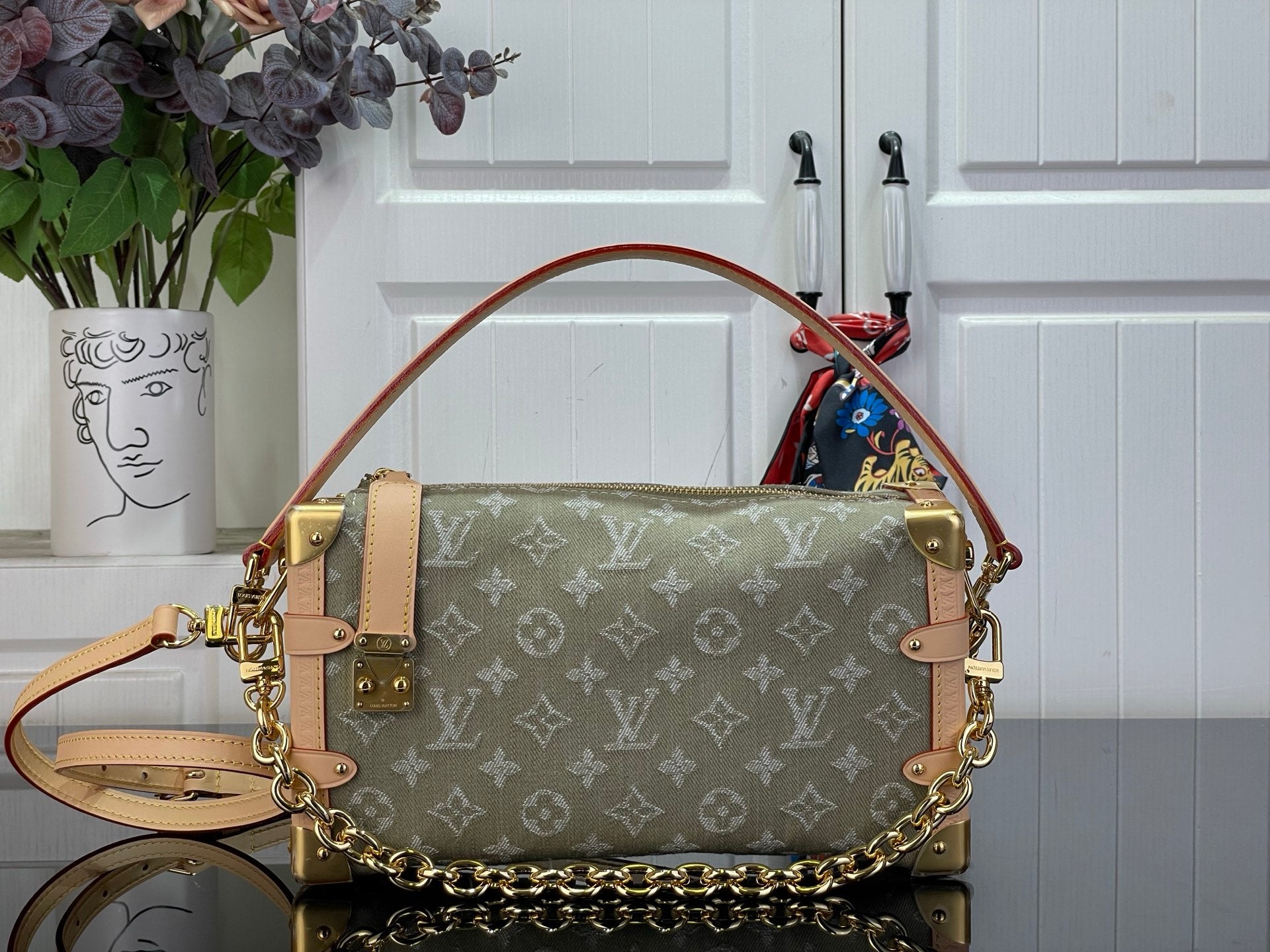Louis Vuitton monogram handbag with top handle, shoulder strap and gold-tone hardware