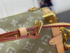 Louis Vuitton monogram bag zipper pull with red-brown leather strap and gold charm