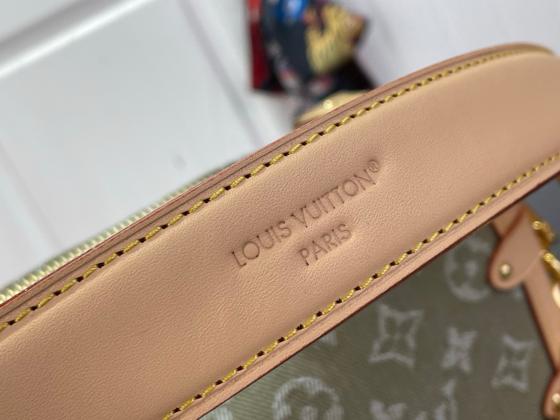 Louis Vuitton Paris leather strap with contrast stitching along the bag edge