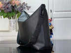 Louis Vuitton hobo bag angled view with front snap and side strap details