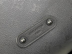 Louis Vuitton hobo bag close-up of snap hardware on dark textured leather