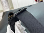 Louis Vuitton hobo bag close-up of side strap connector and embossed texture