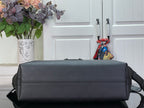 Louis Vuitton hobo bag front view with zip top and structured leather body