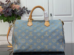 Louis Vuitton light blue monogram tote bag with tan leather top handles and hanging tags