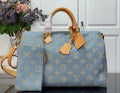 Louis Vuitton light blue monogram tote bag with tan leather handles and shoulder strap
