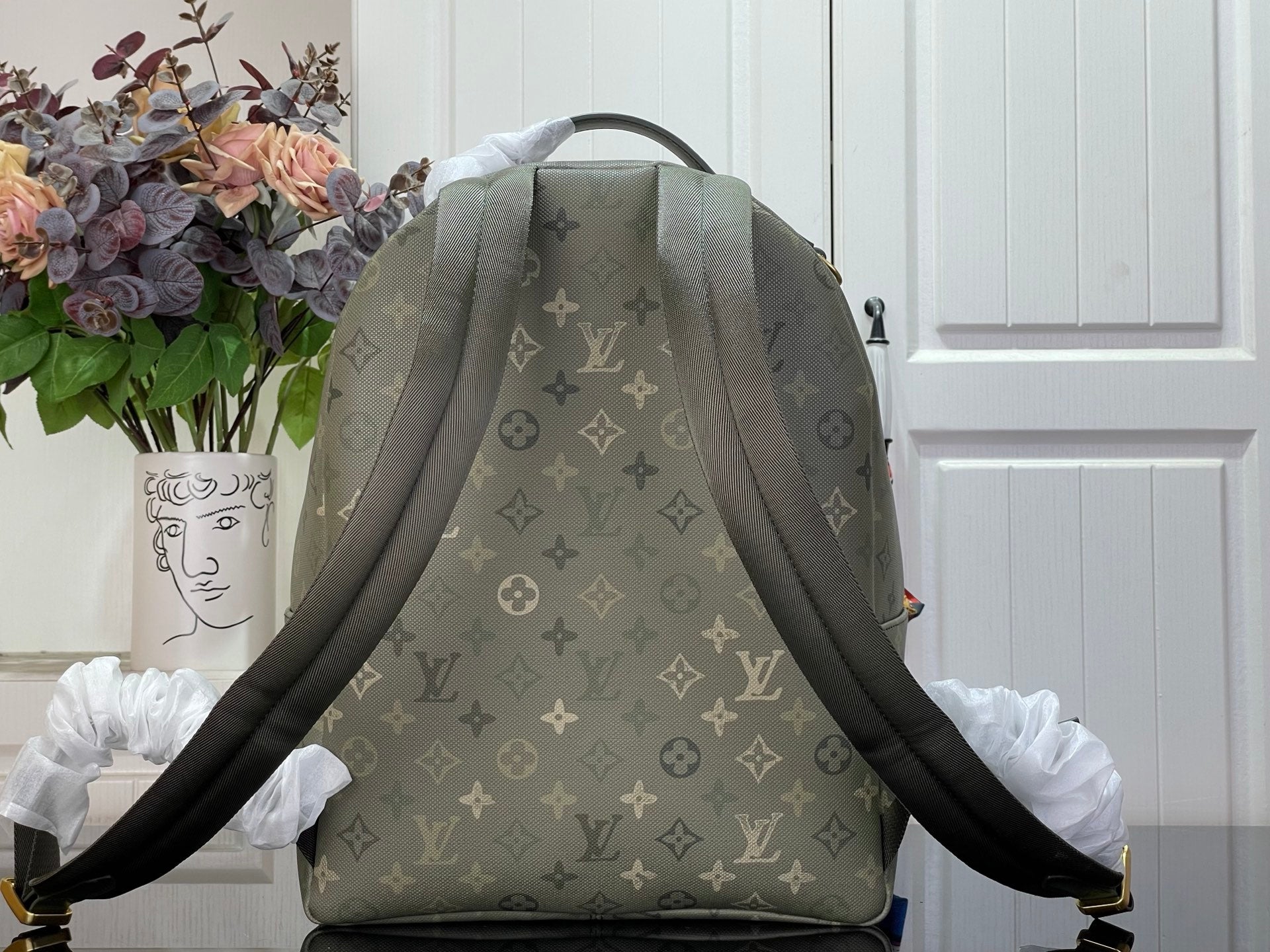 Louis Vuitton monogram backpack with two adjustable shoulder straps, gray-green