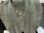 Louis Vuitton monogram backpack with textured gray-green shoulder straps